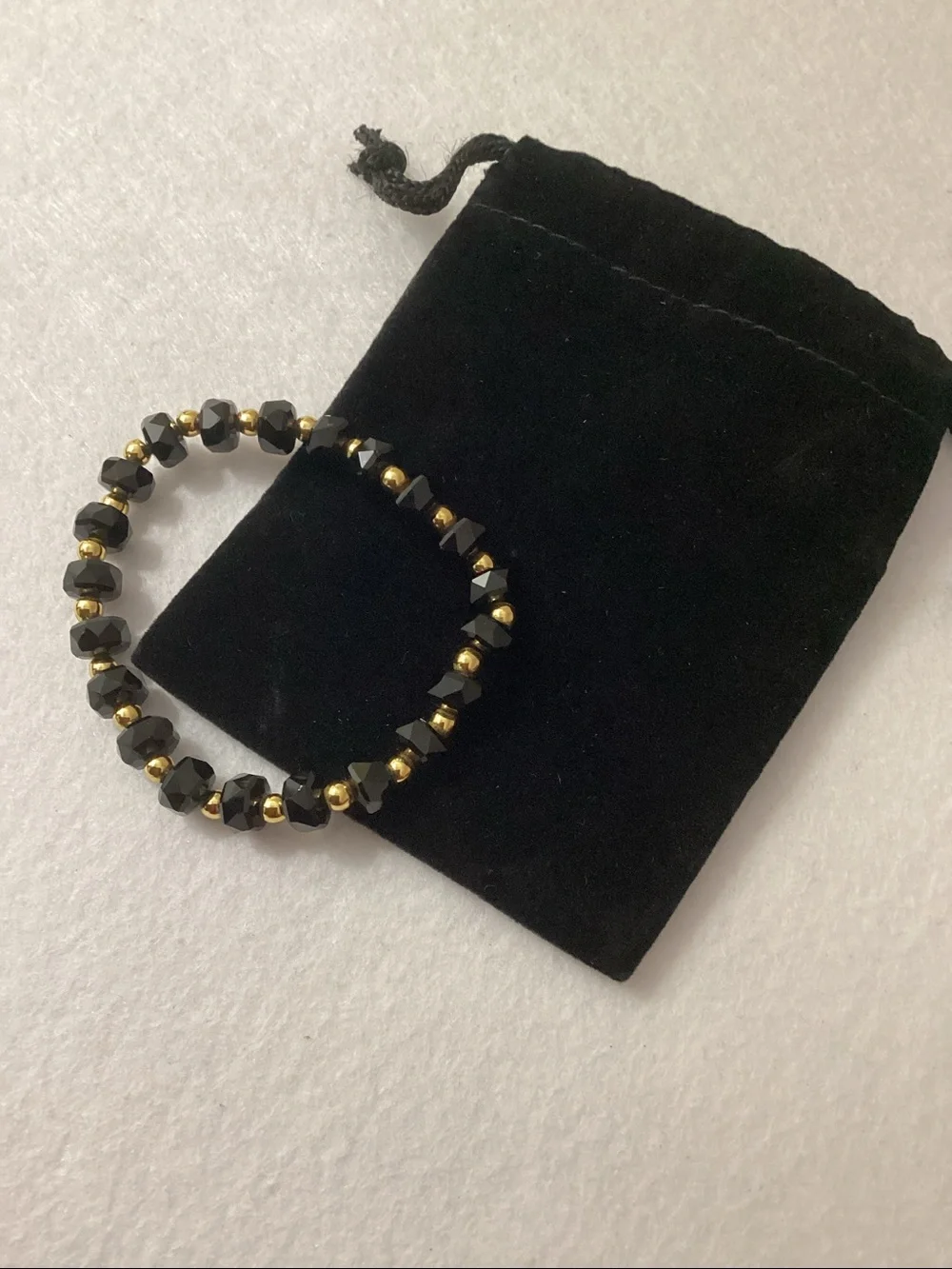 Macy’s Black Crystal and 14K Gold Plated Ball Stretch Bracelet